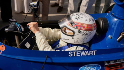 Michael Schumacher signs Stewart’s charity helmet for Tyrrell demo run in Bahrain