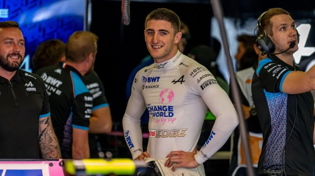 Jack Doohan smiling in the Alpine garage