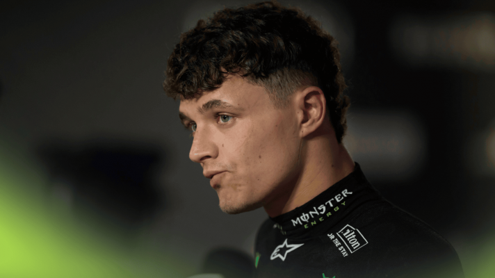 Lando Norris bites the inside of his mouth as he faces the media in Jeddah
