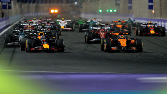 Max Verstappen and Oscar Piastri lead the field on the approach to the first corner at the start of the Saudi Arabian GP