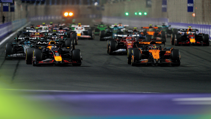 Max Verstappen and Oscar Piastri lead the field on the approach to the first corner at the start of the Saudi Arabian GP