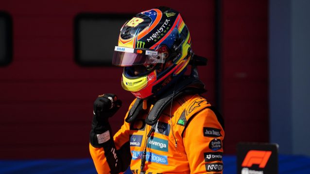 Oscar Piastri punches the air after climbing out of his McLaren having qualified on pole for the Emilia Romagna Grand Prix.