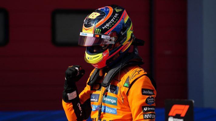 Oscar Piastri punches the air after climbing out of his McLaren having qualified on pole for the Emilia Romagna Grand Prix.