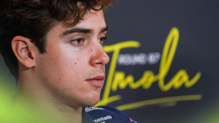 A close-up shot of Franco Colapinto in a press conference at Imola