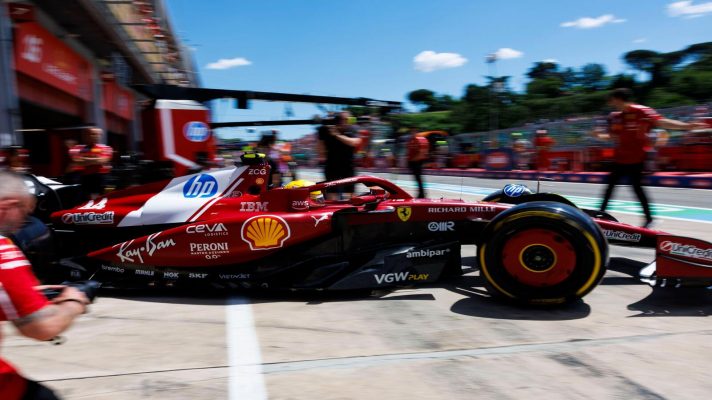 ;Hamilton drives his Ferrari out of the garage and into the Imola pit lane.