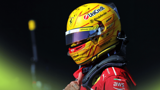 Lewis Hamilton with the visor of his yellow helmet slightly open
