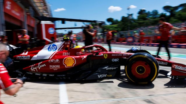 Lewis Hamilton exits his Ferrari garage and drivers into the Imola pit lane.