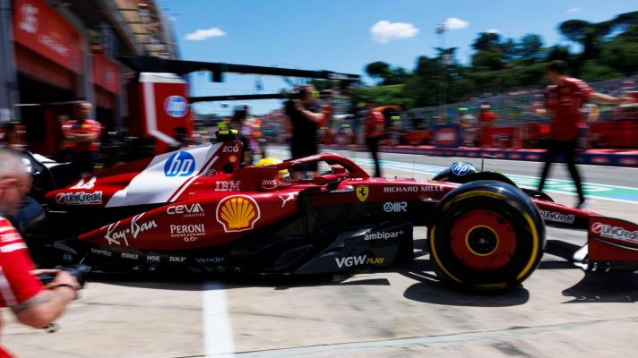 Lewis Hamilton exits his Ferrari garage and drivers into the Imola pit lane.