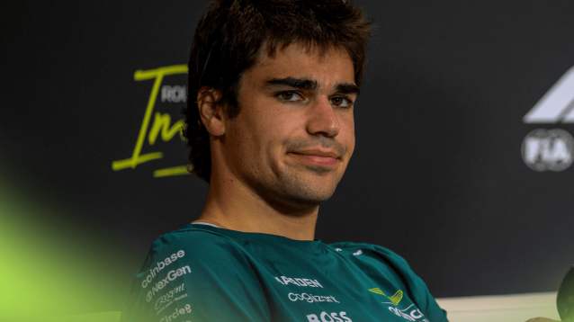 Lance Stroll looks on in a press conference