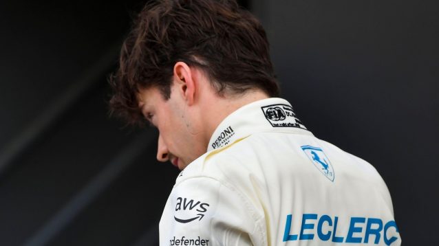 Ferrari's Charles Leclerc with his back to the camera at the 2025 Monaco Grand Prix