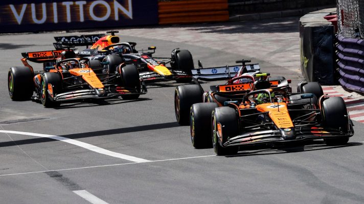 Lando Norris leads the field out of Sainte Devote on the opening lap of the Monaco Grand Prix.