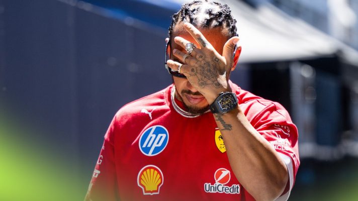 Ferrari driver Lewis Hamilton puts his hand to his head at the 2025 Spanish Grand Prix