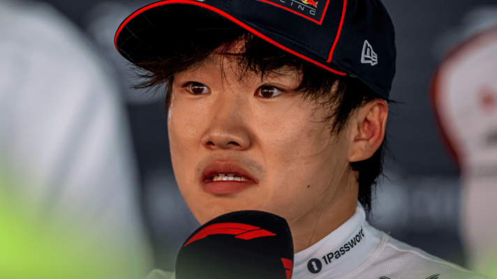 Yuki Tsunoda looks anguished as he faces the media in Spain