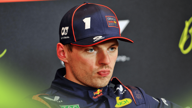 Max Verstappen looks annoyed in a press conference at the Spanish GP
