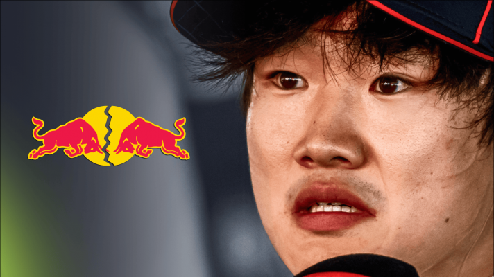 A close-up shot of a distressed Yuki Tsunoda with a cracked Red Bull logo alongside him