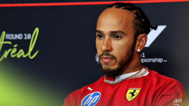 Lewis Hamilton looks on in a press conference in Canada