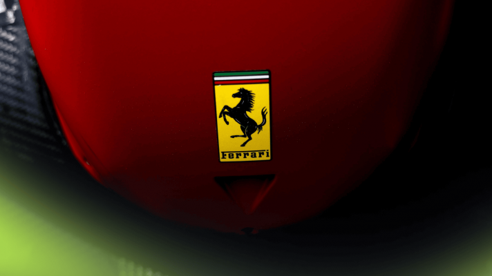 A close-up shot of the Ferrari logo on the nose of the SF-25 car