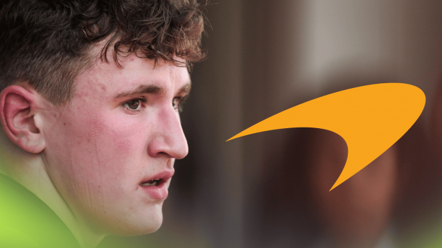 A close-up shot of Alex Dunne with a prominent McLaren logo alongside him