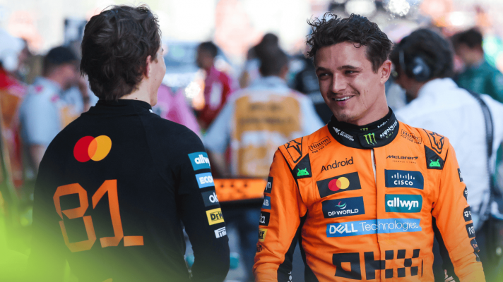 Lando Norris smiles in conversation with Oscar Piastri in parc ferme in Austria