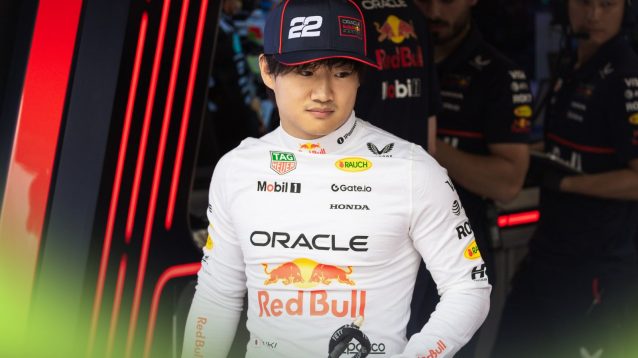 Yuki Tsunoda pictured in front of the Red Bull garage at the 2025 Austrian Grand Prix