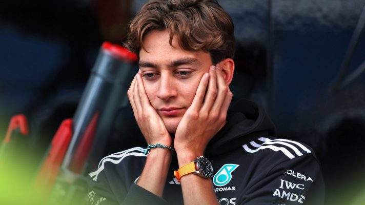 Mercedes driver George Russell pictured with his hands on his face at the 2025 British Grand Prix