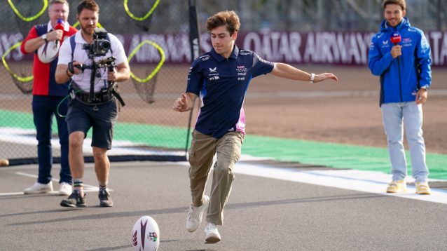 Franco Colapinto kicking a rugby ball with Sky F1