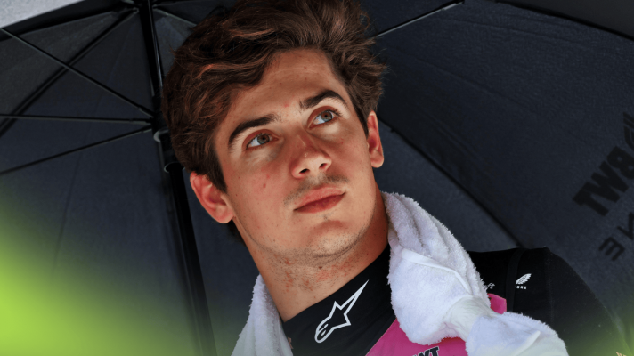 Franco Colapinto stood with a towel around his neck on the grid
