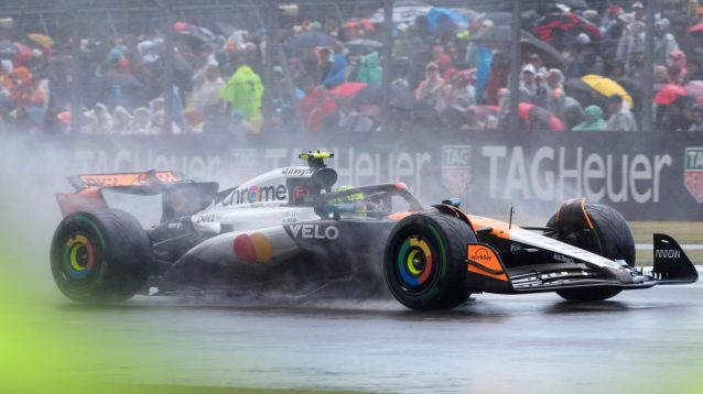 Lando Norris, McLaren, driving through the rain at the 2025 British Grand Prix