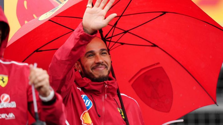 Lewis Hamilton waves to the crowd at Silverstone.