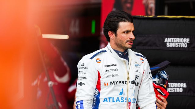 Carlos Sainz walking down the pit lane