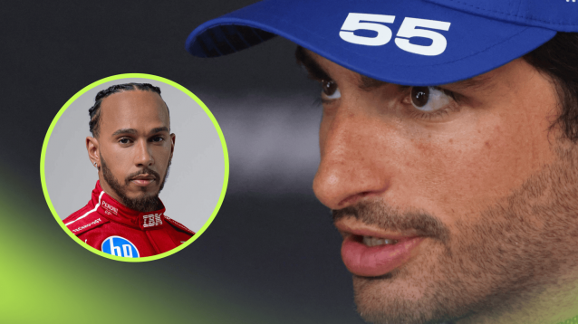 Carlos Sainz speaks to the media while wearing a Williams cap with an inset of Lewis Hamilton in Ferrari overalls