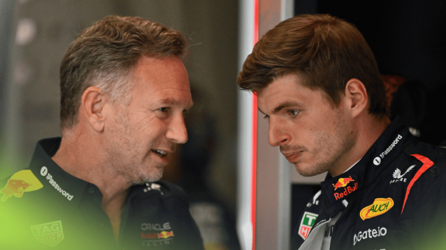 Christian Horner and Max Verstappen in conversation in the Red Bull garage