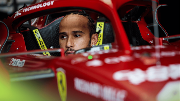 Lewis Hamilton sat in the cockpit of his Ferrari SF025 without his helmet on