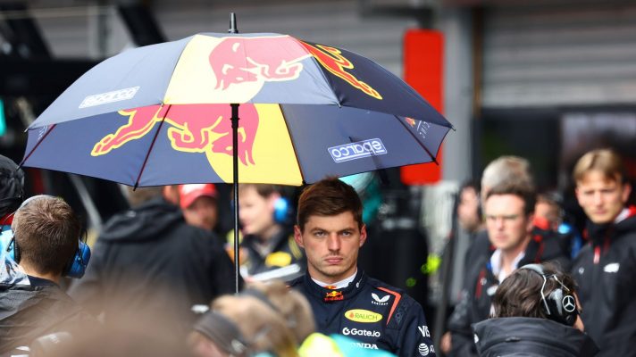 Max Verstappen with an umbrella