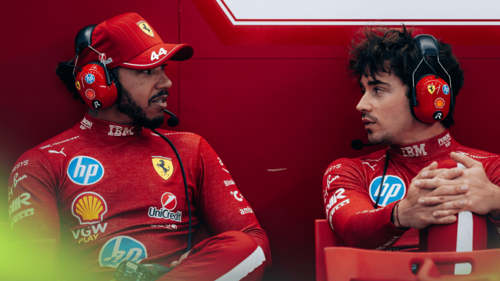 Lewis Hamilton and conversation while sitting at the back of the Ferrari garage