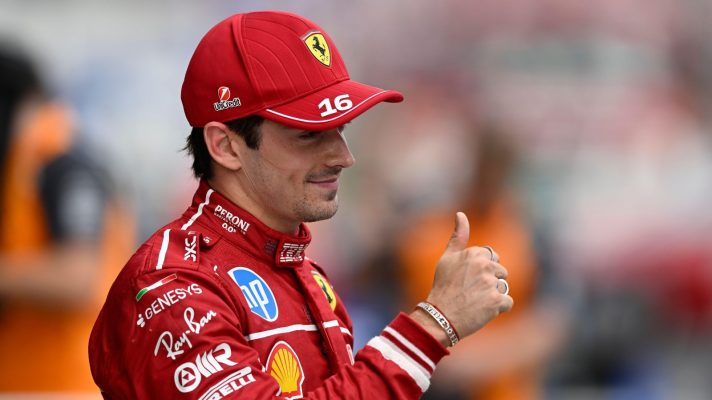 Charles Leclerc gives a thumbs up after securing pole.
