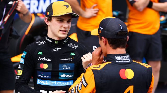 Oscar Piastri speaking with Lando Norris