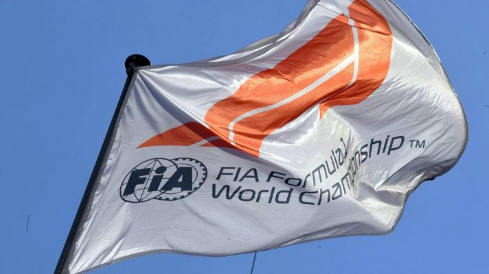 A FIA F1 World Championship flag on display in the paddock.