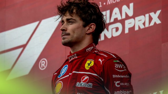 Ferrari driver Charles Leclerc stands on the podium at the 2025 Belgian Grand Prix