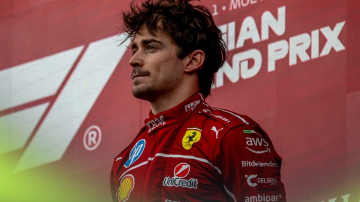 Ferrari driver Charles Leclerc stands on the podium at the 2025 Belgian Grand Prix