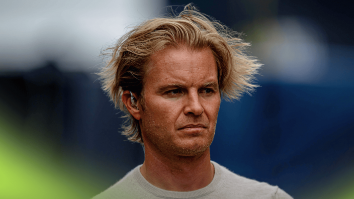 Nico Rosberg's hair blows in the wind as he makes his way through the F1 paddock at Spa