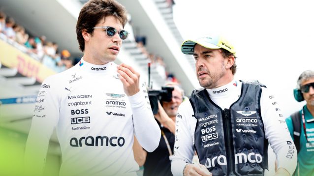 Aston Martin drivers Lance Stroll and Fernando Alonso in conversation at the 2025 Miami Grand Prix