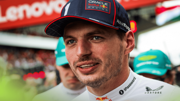 Max Verstappen smiles as he prepares for the start of the 2025 Hungarian Grand Prix