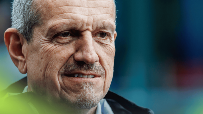 A close-up shot of Guenther Steiner in conversation in the F1 paddock