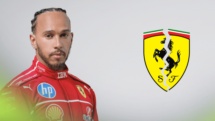 Lewis Hamilton poses in Ferrari F1 overalls against a white background with a cracked Ferrari logo alongside him