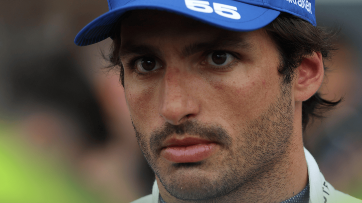 A close-up shot of Carlos Sainz wearing a Williams cap