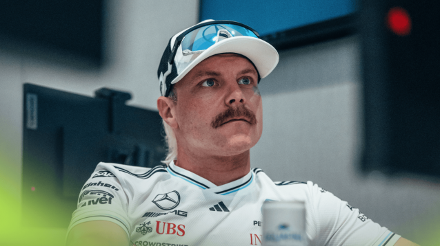 Valtteri Bottas looks on in Mercedes' hospitality unit