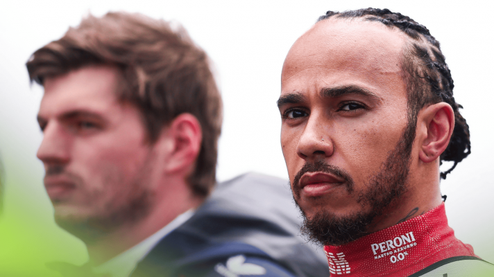 Lewis Hamilton on the grid at Silverstone with Max Verstappen in the background