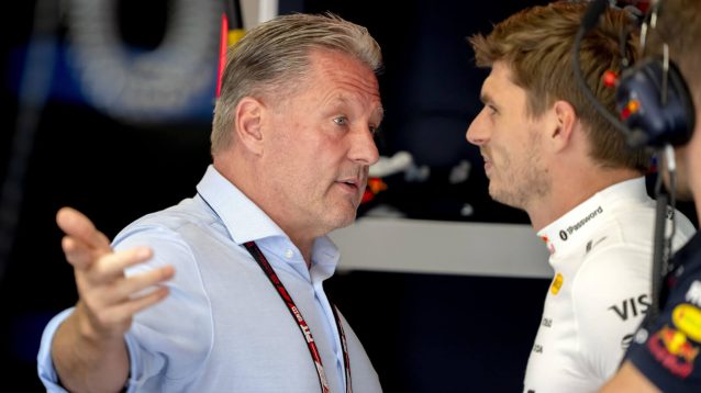 Jos Verstappen speaking with Max Verstappen in the Red Bull garage
