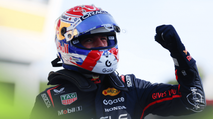 Max Verstappen punches the air in celebration in parc ferme at Monza